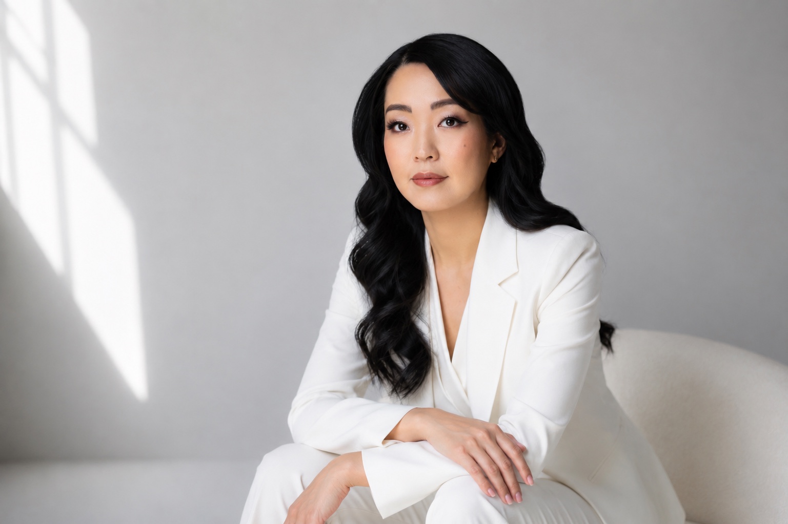 Midya U, founder of Midya U Advisory, in a white suit
